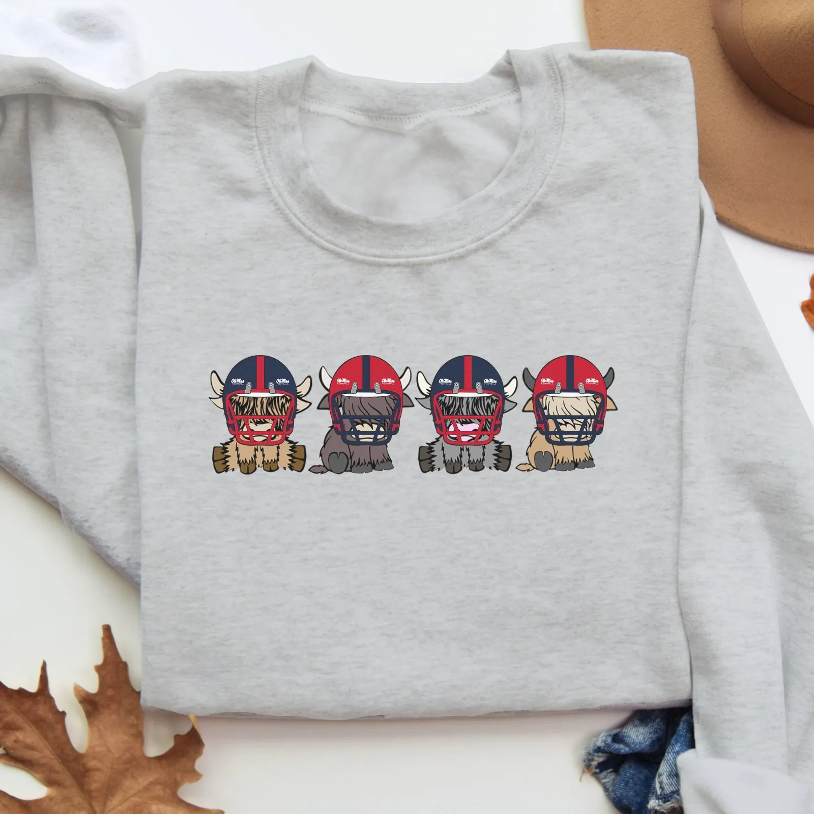 Ole Miss Rebels Football Highland Cow Football Team Football Lovers Gift Unisex Crewneck Hoodie Sweatshirt